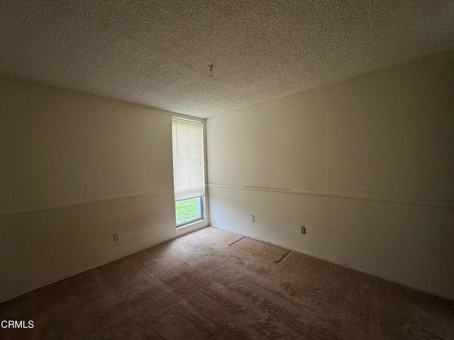 3700 Dean Dr Unit 3405, Ventura, CA 93003 - carpeted spare room with a textured ceiling