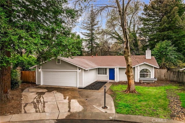 ranch-style home featuring fence, a garage, and driveway