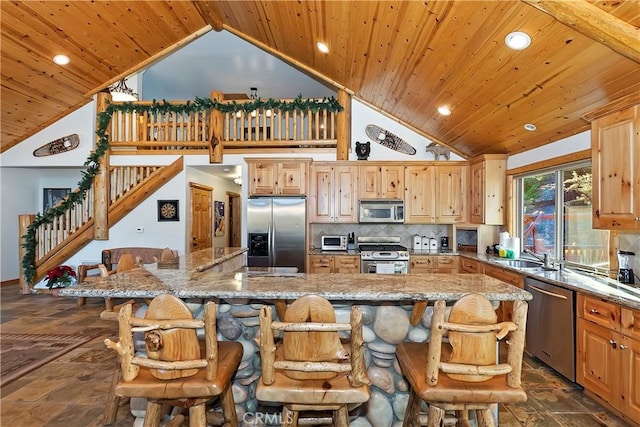 kitchen featuring backsplash, appliances with stainless steel finishes, wooden ceiling, and high vaulted ceiling