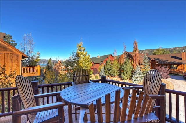 wooden deck featuring outdoor dining area