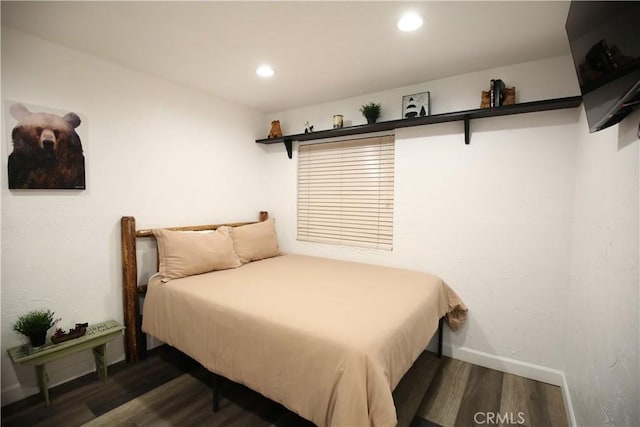 bedroom featuring recessed lighting, wood finished floors, and baseboards