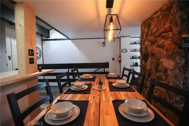 dining space with wood finished floors