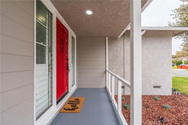 property entrance with stucco siding and crawl space