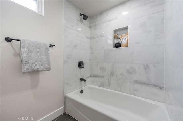 full bathroom featuring tile patterned flooring, shower / tub combination, and baseboards