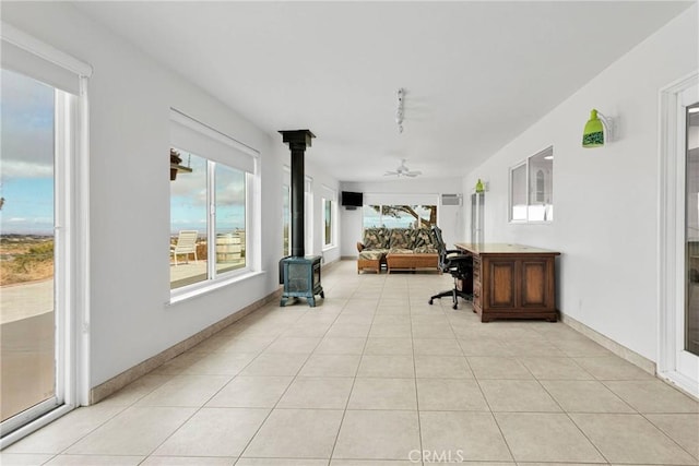 sunroom featuring a wood stove