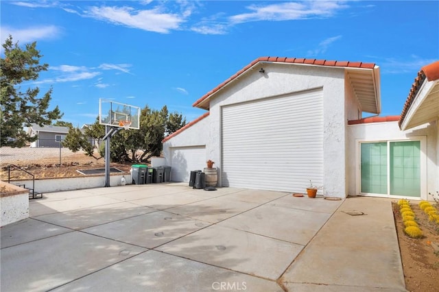 exterior space with concrete driveway