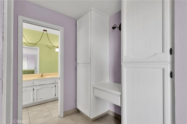 bathroom with tile patterned flooring and vanity