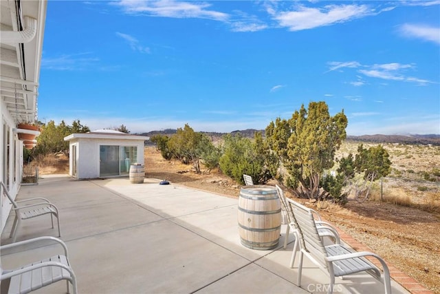 view of patio / terrace with an outdoor structure