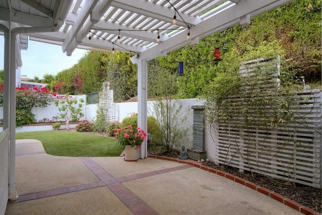 view of patio / terrace featuring a pergola and fence