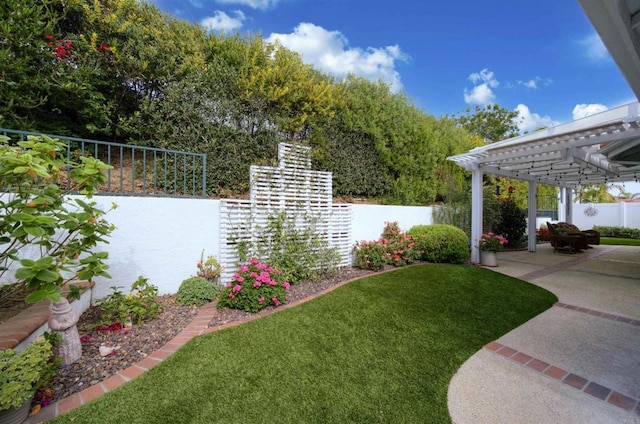 view of yard with a patio, a fenced backyard, and a pergola