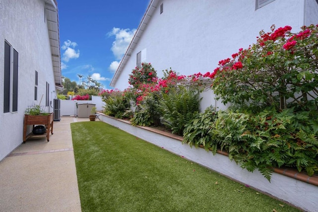 view of yard featuring a patio and fence