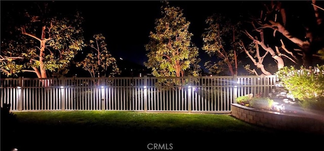 view of property's community featuring fence