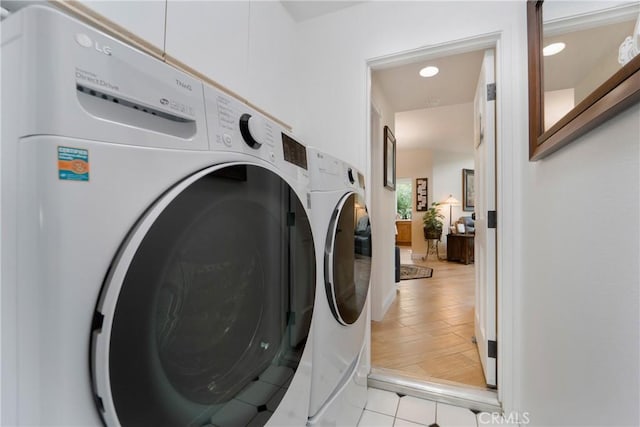 washroom featuring washer and clothes dryer, laundry area, and recessed lighting