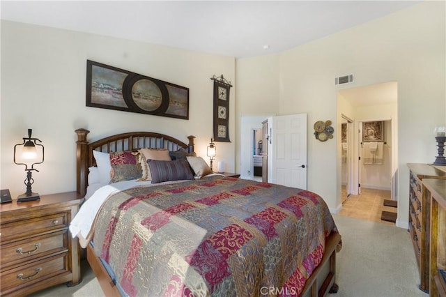 bedroom with visible vents, carpet floors, high vaulted ceiling, and baseboards