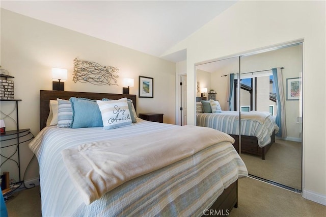 bedroom featuring vaulted ceiling, carpet, a closet, and baseboards