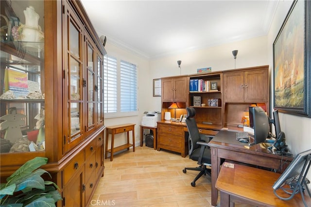 office area with crown molding, baseboards, and wood tiled floor