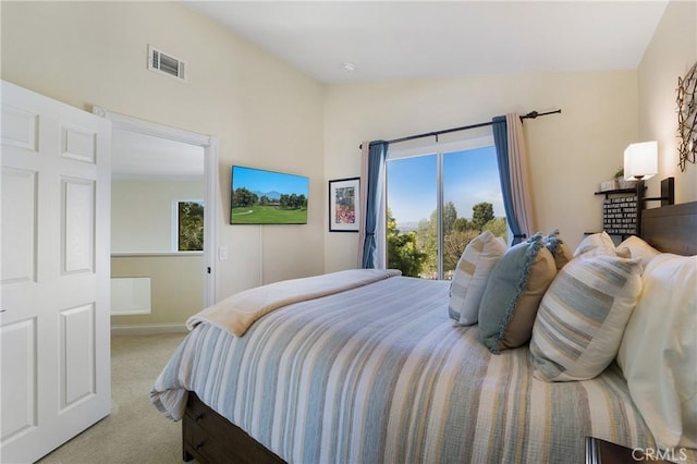 bedroom featuring access to exterior, visible vents, light colored carpet, and vaulted ceiling