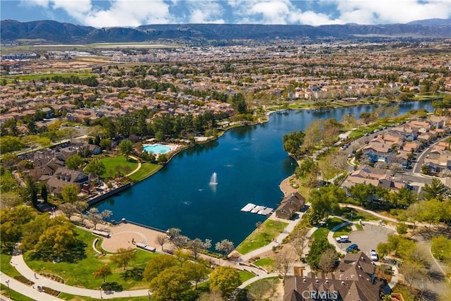 aerial view featuring a residential view and a water and mountain view