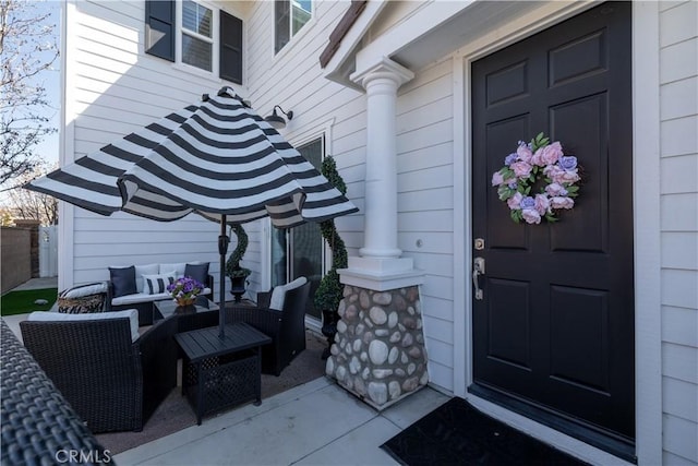 doorway to property featuring outdoor lounge area