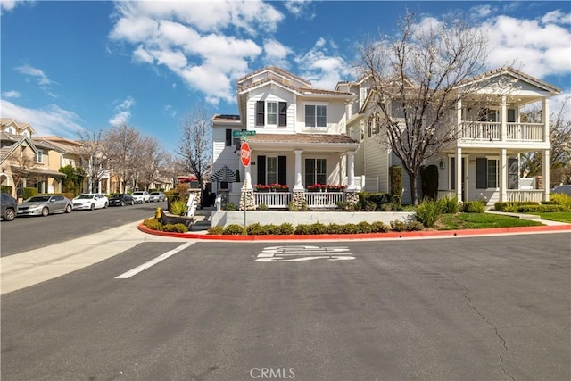 view of front of house with covered porch and a residential view