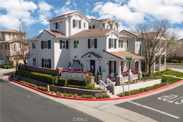 view of front of house featuring a tile roof