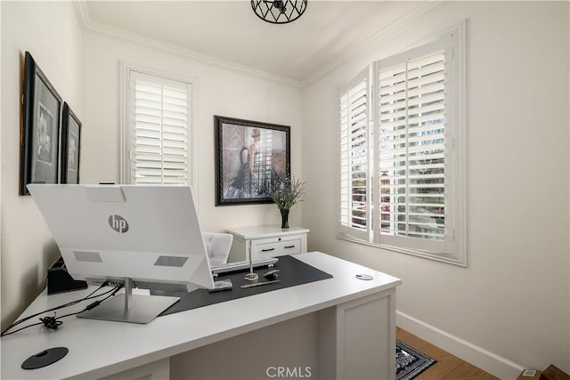 office featuring crown molding, wood finished floors, and baseboards