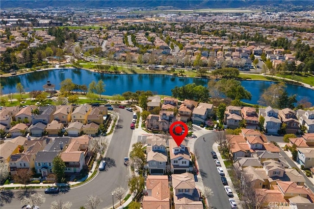 bird's eye view featuring a residential view and a water view