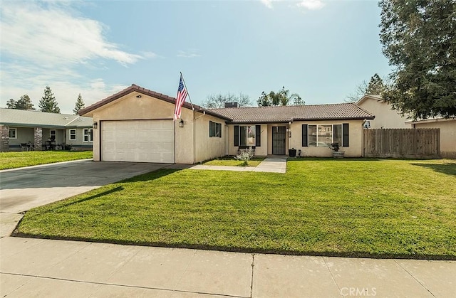 view of front of home with stucco siding, a front lawn, fence, concrete driveway, and an attached garage