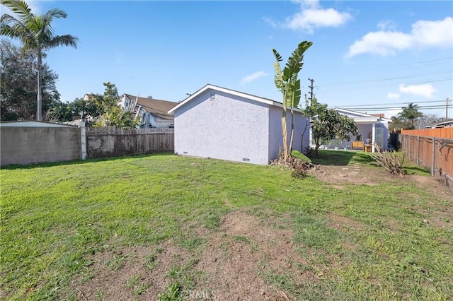 view of yard featuring a fenced backyard