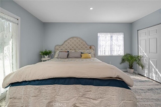 bedroom featuring a closet and baseboards