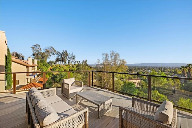 wooden deck with outdoor lounge area