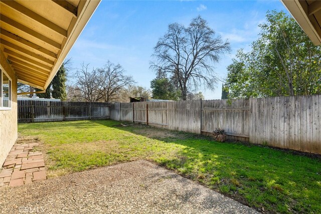 view of yard with a fenced backyard