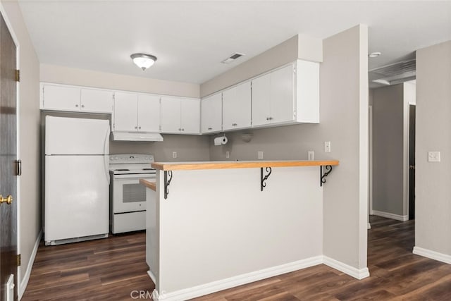 kitchen with under cabinet range hood, visible vents, white appliances, and dark wood-style flooring