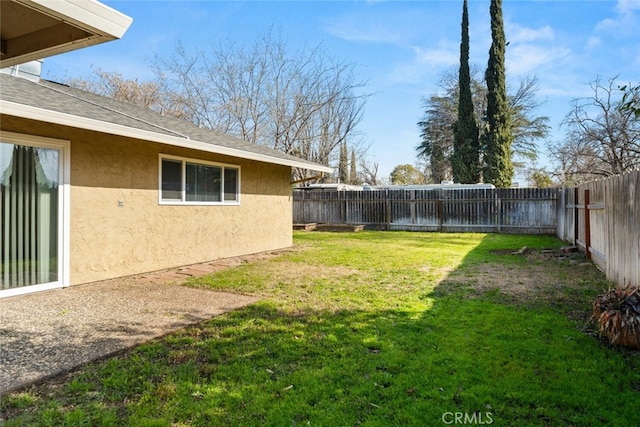 view of yard with a fenced backyard