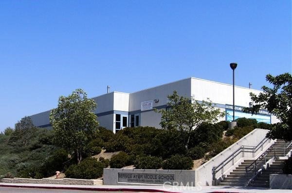 view of property featuring stairs