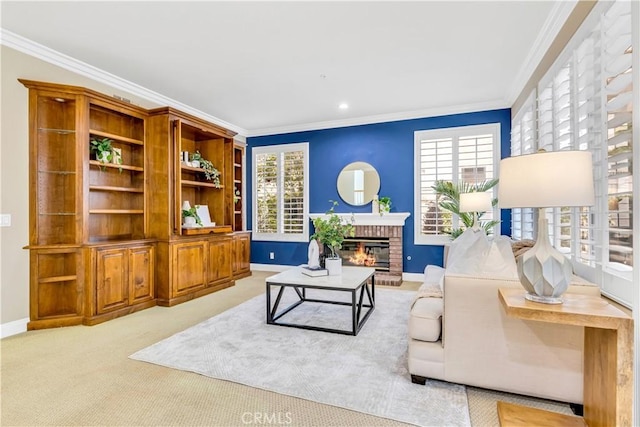 carpeted living room with crown molding, a fireplace, and baseboards