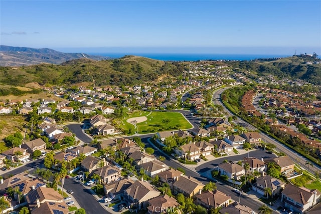 birds eye view of property with a mountain view and a residential view