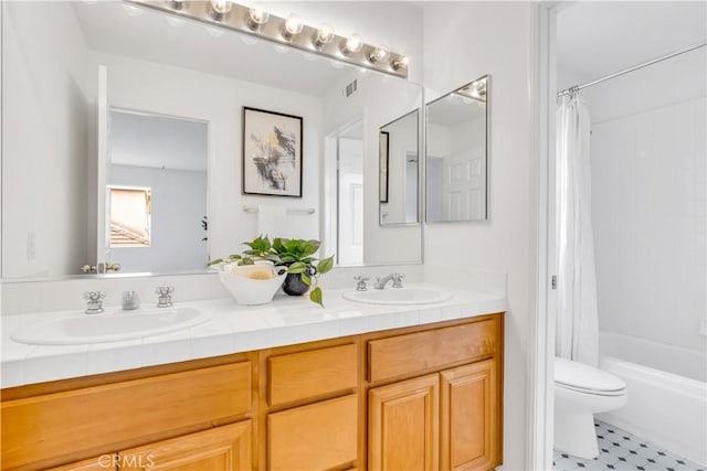 bathroom featuring double vanity, shower / bathtub combination with curtain, toilet, and a sink