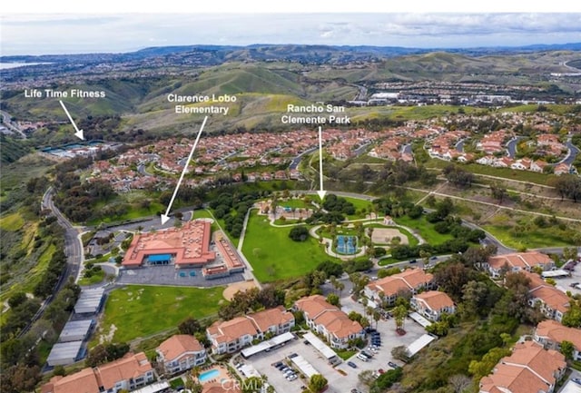 birds eye view of property with a residential view