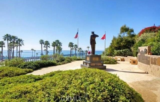 surrounding community featuring a water view