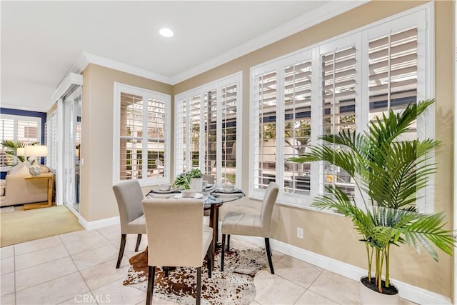 dining area featuring light tile patterned floors, recessed lighting, baseboards, and ornamental molding