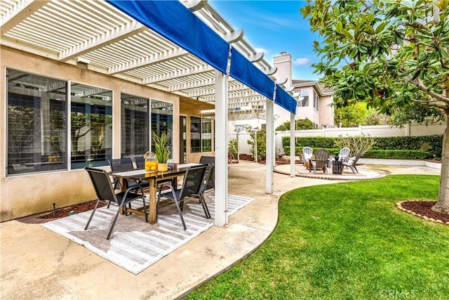 view of patio with a fire pit, a pergola, outdoor dining area, and fence