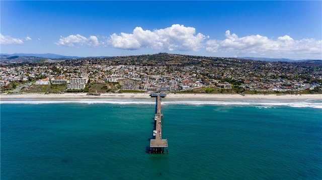 drone / aerial view with a water and mountain view