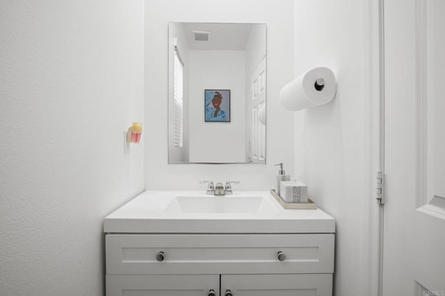 bathroom featuring visible vents and vanity