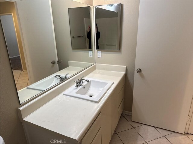 bathroom featuring tile patterned floors and vanity