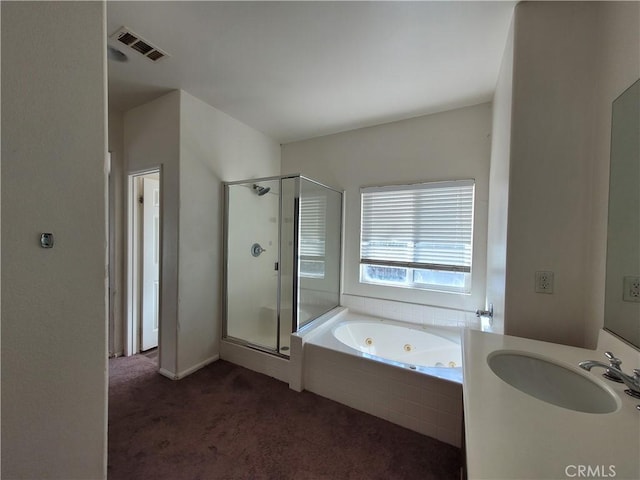 full bathroom featuring vanity, a shower stall, visible vents, and a whirlpool tub