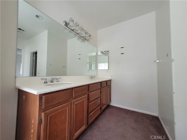 full bathroom featuring a sink, visible vents, baseboards, and double vanity