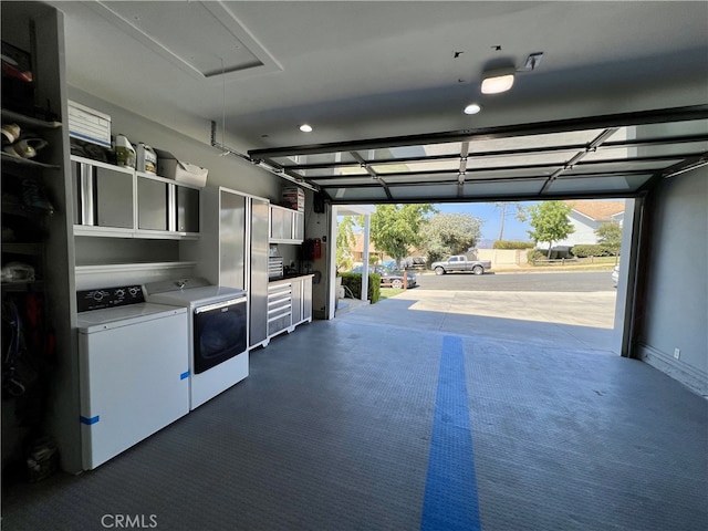 garage with washing machine and dryer