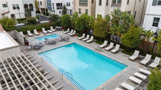 pool featuring a patio and fence