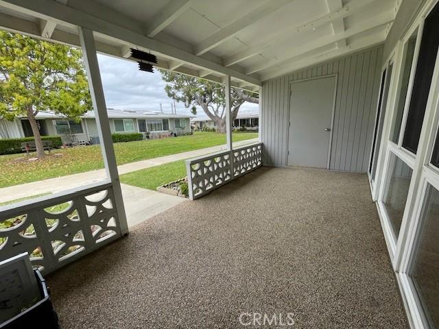 view of patio featuring a carport and covered porch